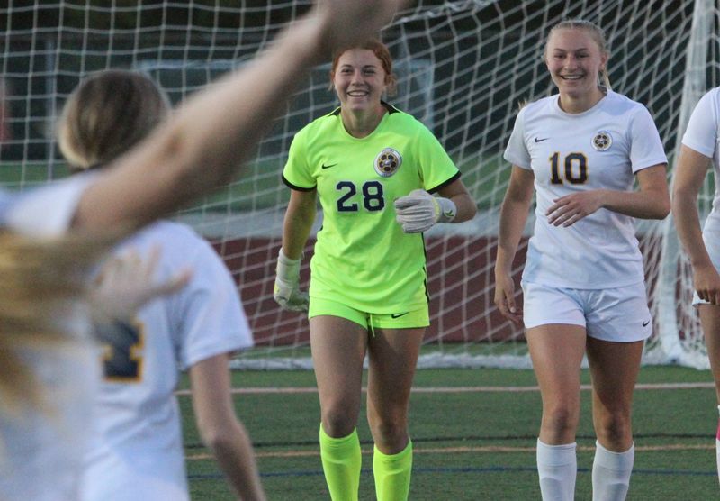 Hartland players rush toward goalie Haley DePestel (28) following a 3-0 victory over Northville in the KLAA girls soccer championship game on Thursday, May 14, 2026 at Northville High School.