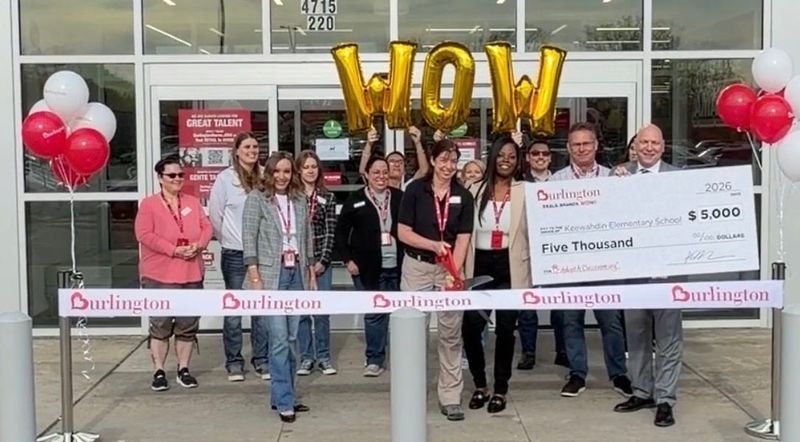 Burlington employees and Keewahdin Elementary School principal pose during a ribbon-cutting ceremony outside the new Burlington store on May 15, 2026 in Fort Gratiot Township. The retailer also presented a $5,000 donation to the school through AdoptAClassroom.org.
