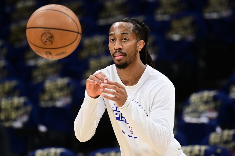 Pistons guard Daniss Jenkins (24) warms up before Game 6 against the Cavaliers in the second round of the 2026 NBA Playoffs at Rocket Arena in Cleveland.