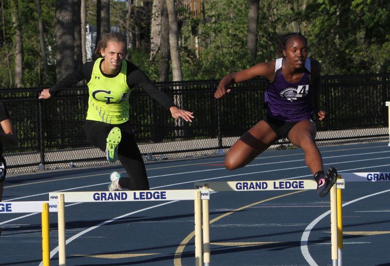Katie Blue (left) of Grand Ledge was first and Arenn Starks (right) of Battle Creek Lakeview was second in the 300-meter hurdles during the Division 1 track and field regional on Friday, May 15, 2026 at Grand Ledge High School.