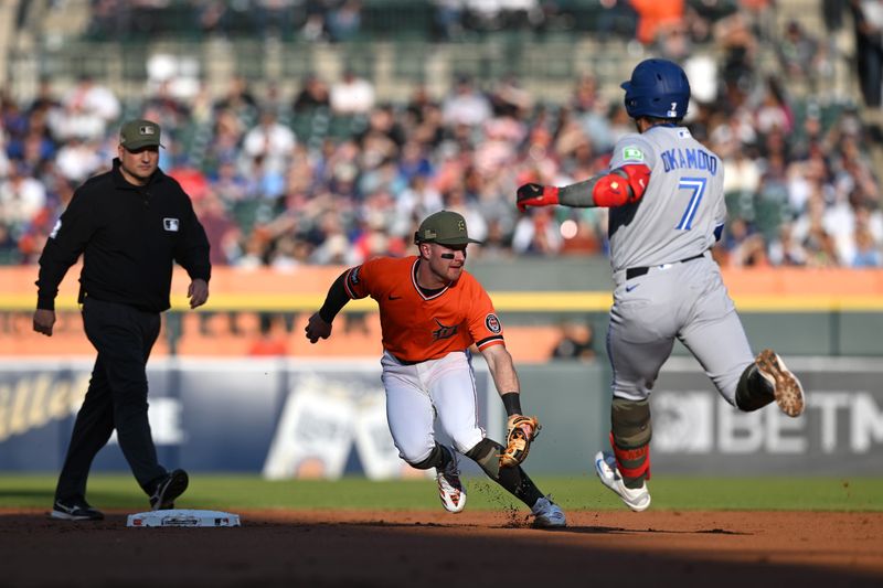 Toronto Blue Jays third baseman Kazuma Okamoto hustles into second base to avoid the tag from Detroit Tigers shortstop Kevin McGonigle for a double in the second inning at Comerica Park, Friday, May 15, 2026.