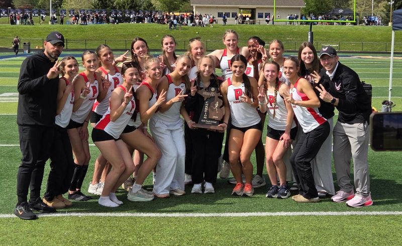 Pinckney's girls track and field team celebrates a second straight regional championship on Friday, May 15, 2026 at Chelsea High School.