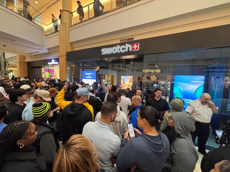 A crowd gathers at Somerset Mall in Troy to buy a watch collaboration between Swatch and Audemars Piguet on Saturday, May 16, 2026.