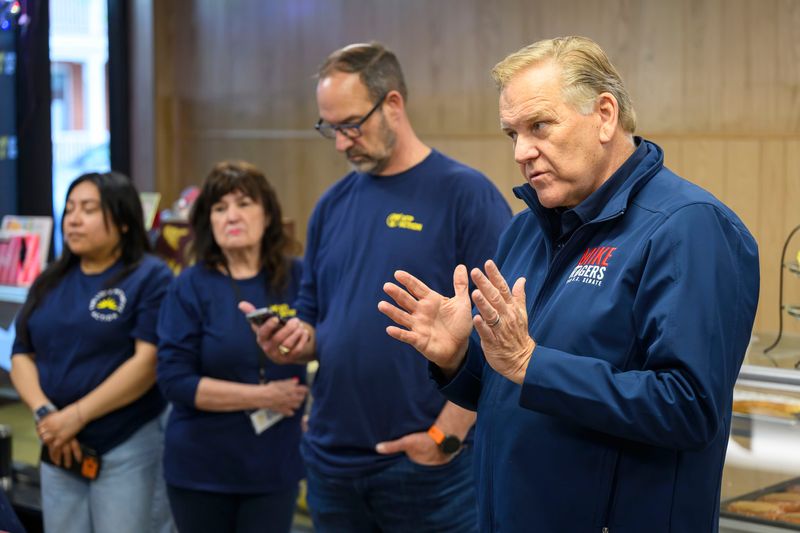 Former U.S. Rep. Mike Rogers, a candidate for U.S. Senate, speaks with volunteers before heading out for a day of door-to-door campaigning with AFP Action on Saturday, May 16, 2026 at Elliott’s Bakery in Trenton, Mich.