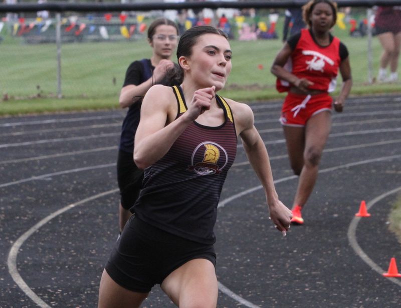 Charyl Stockwell Academy's Lauren Hammond runs the 200-meter dash prelims during the Division 3 regional track and field meet on Saturday, May 16 at Stockbridge High School.