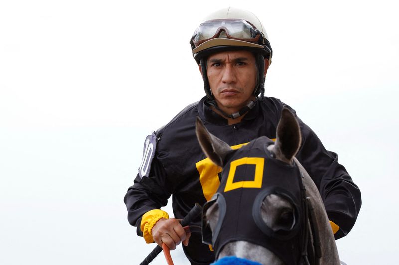 Napoleon Solo ridden by Paco Lopez walks during the parade lap prior to the running of the 151st Preakness Stakes.