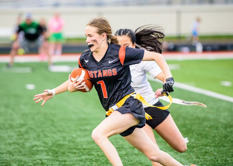 Northville's Taylor Chrzanowski rushes during a Michigan Girls High School Flag Football League game on Saturday, May 16, 2026.