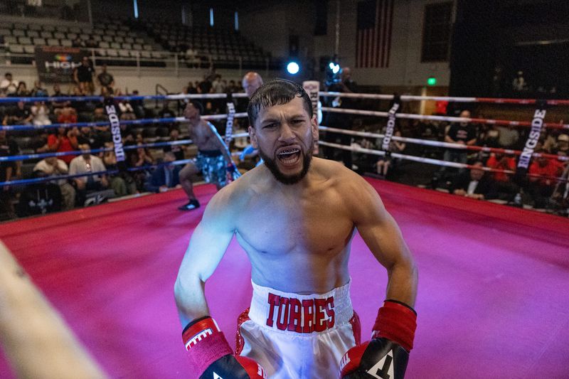 Holland's Anthony Torres reacts after winning a boxing match by knockout during the Great Lakes Grudge East vs. West Pro-Am Boxing event on Saturday, May 16, at the Holland Civic Center.