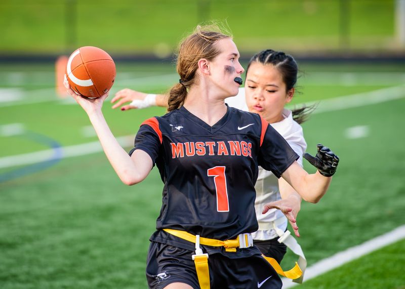Northville's Taylor Chrzanowski passes during a Michigan Girls High School Flag Football League game on Saturday, May 16, 2026.
