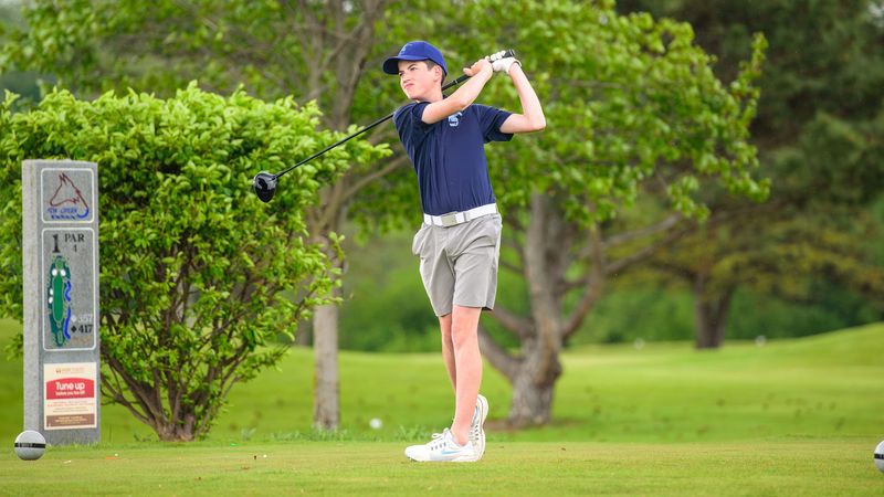 LIvonia Stevenson's Owen McGlinch tees off during a Kensington Lakes Activities Association-East golf match on Monday, May 18, 2026, at Fox Creek Golf Course.
