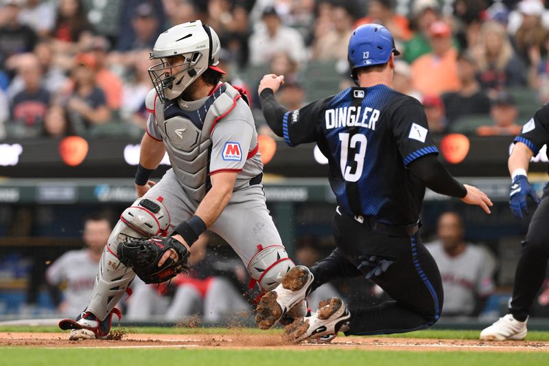 May 18, 2026; Detroit, Michigan, USA; Detroit Tigers catcher Dillon Dingler (13) slides safely into home plate ahead of the throw to Cleveland Guardians catcher Austin Hedges (27) in the first inning at Comerica Park. Mandatory Credit: Lon Horwedel-Imagn Images