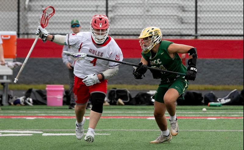 Bedford's Jalen Porter controls the ball against Cameron Martin of St. Mary Catholic Central during a 19-1 Bedford victory on Monday, May 19, 2026.