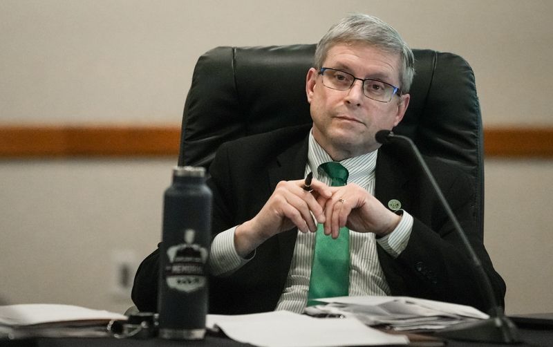 East Lansing City Manager Robert Belleman listens as members of the community speak out against him during the East Lansing City Council meeting, Tuesday, May 19, 2026. Several people called for both he and Police Chief Jennifer Brown to resign.
