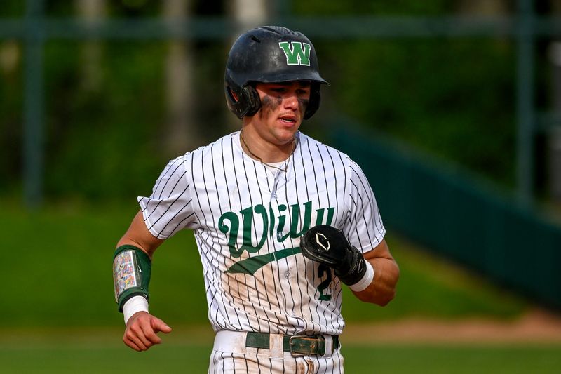 Williamston's Kaleb Nielson gets to third base against Lansing Catholic in the fourth inning on Tuesday, May 19, 2026, during the Diamond Classic at McLane Stadium in East Lansing.