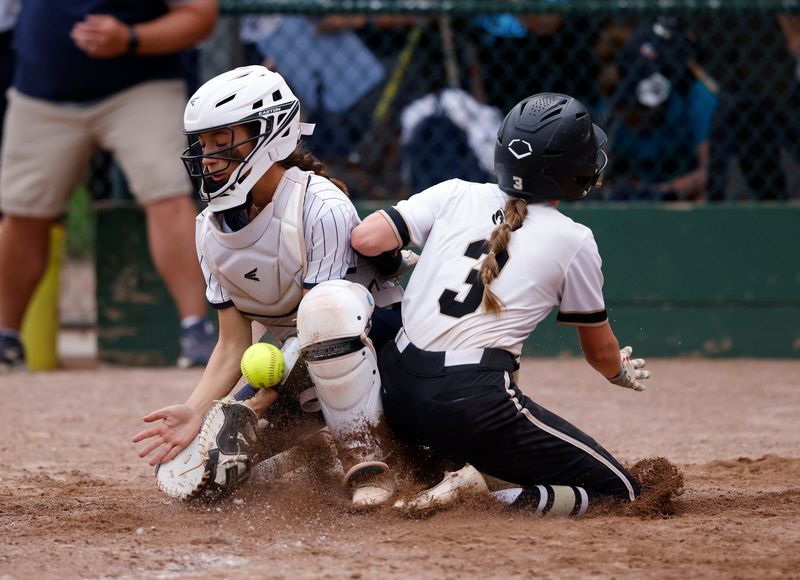 Holt's Harper Vandlen, right, scores against DeWitt's Mikayla Kent, Tuesday, May 19, 2026, at Ranney Park.