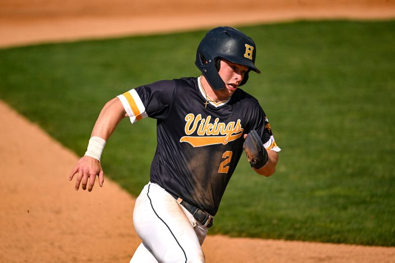Haslett's Ayden Smith rounds third base on his way to scoring a run against Portland in the second inning on Wednesday, May 20, 2026, during the Diamond Classic at McLane Stadium in East Lansing.