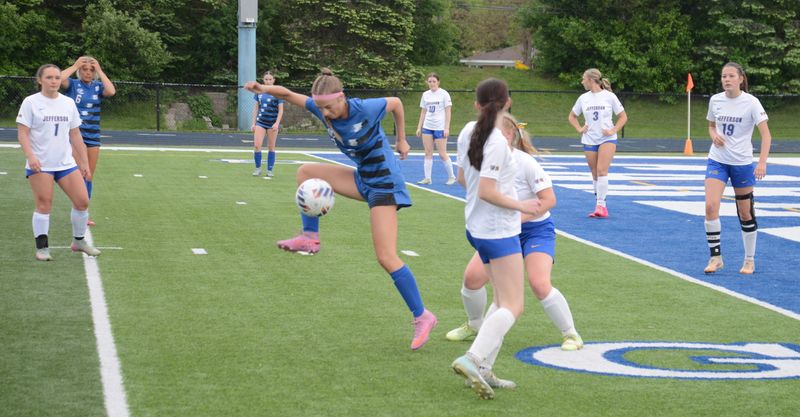 Gibraltar Carlson's Jillian Farago settles the ball while surrounded by Jefferson-Erie Mason defenders during an 8-1 Carlson victory in a Division 2 District quarterfinal game on Wednesday, May 20, 2026.