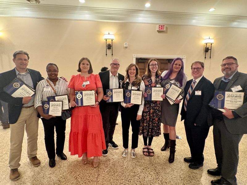 Gary Miles, editor and publisher, from left, reporters Candice Williams, Jennifer Pignolet, Tony Paul, Jennifer Chambers, Anne Snabes, designer Diana McNary, metro editor Richard Burr and managing editor Kevin J. Hardy appear Tuesday, May 20, 2026, at the Detroit Chapter of the Society of Professional Journalists' awards banquet at the San Marino Club in Troy.