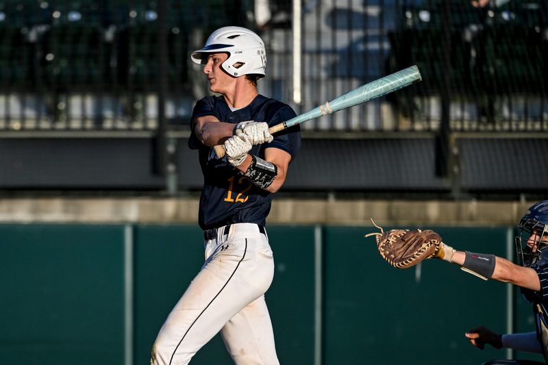 DeWitt's Griffin Braman drives in a run against Lakewood in the first inning on Wednesday, May 20, 2026, during the Diamond Classic at McLane Stadium in East Lansing.