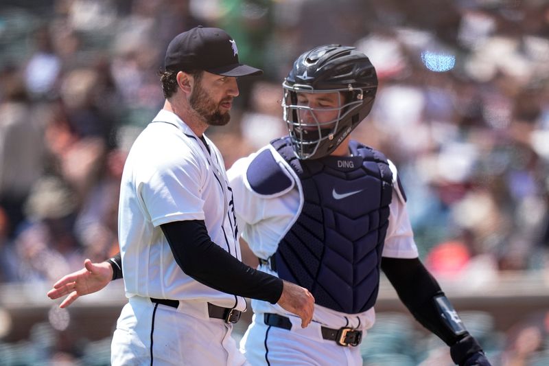 Detroit Tigers pitcher Casey Mize (12), left, talks to catcher Dillon Dingler (13) after throwing against Cleveland Guardians during the fifth inning at Comerica Park in Detroit on Thursday, May 21, 2026.