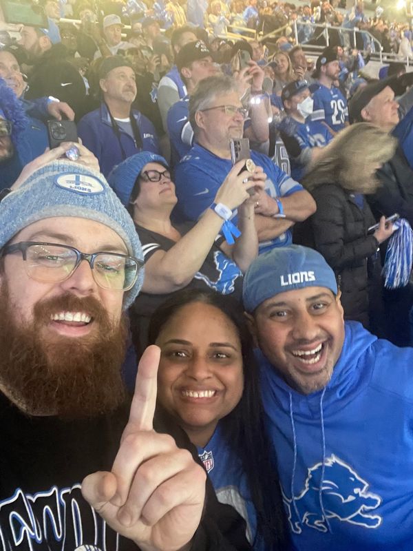 Detroit Lions superfan Sweta Patel (middle) broke the news regarding Jack Campbell's four-year contract extension.