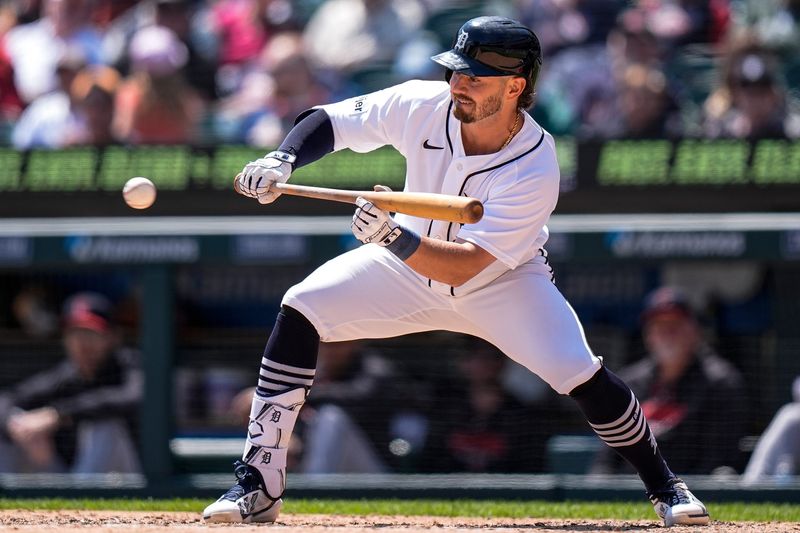 Detroit Tigers second baseman Zach McKinstry (39) bunts against Cleveland Guardians during the seventh inning at Comerica Park in Detroit on Thursday, May 21, 2026.