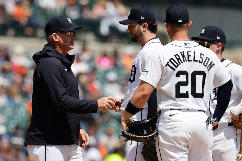 May 21, 2026; Detroit, Michigan, USA; Detroit Tigers manager A.J. Hinch (14) take the ball to relieve pitcher Casey Mize (12) in the seventh inning against the Cleveland Guardians at Comerica Park. Mandatory Credit: Rick Osentoski-Imagn Images
