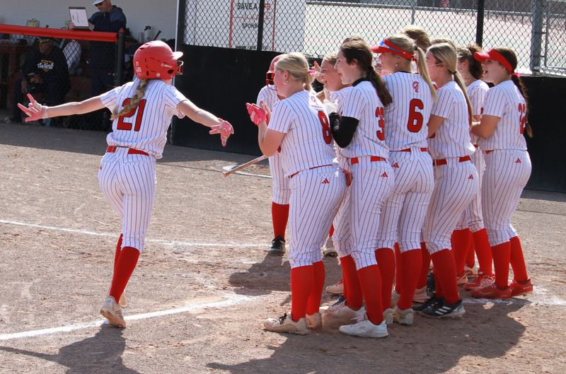 Sierra Danies is greeted by her Monroe teammates after a home run during a 7-6 victory over Chelsea on Thursday, May 21, 2026.