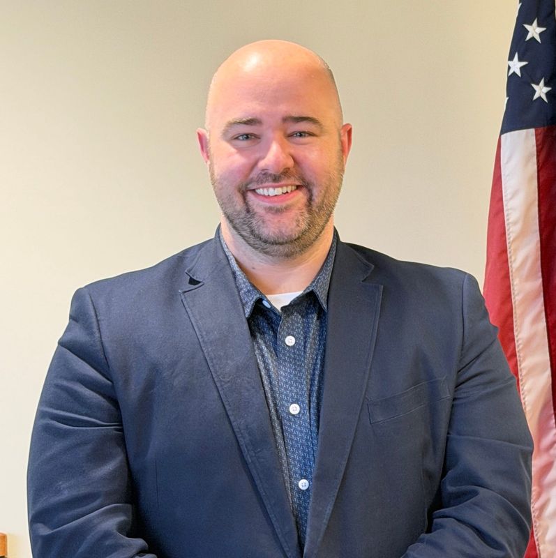 Thomas Hull poses for a portrait photo at the St. Clair County Administrative Office Building in Port Huron in May 21, 2026, after commissioners formally approved him as the county’s administrator/controller.