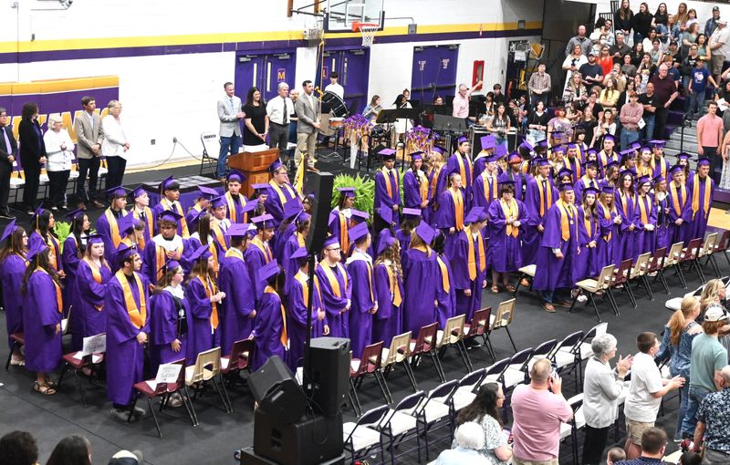 Bronson graduating Class of 2026 stands for congratulation from the friends and family who packed the school gym on Thursday night, May 21.