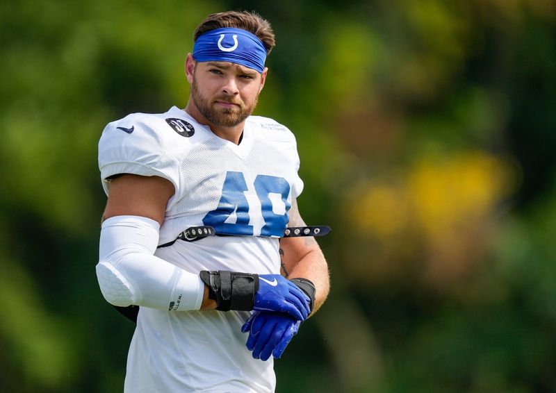 Indianapolis Colts linebacker Joe Bachie (48) walks onto the field Monday, Aug. 11, 2025, during Indianapolis Colts Training Camp at Grand Park in Westfield.