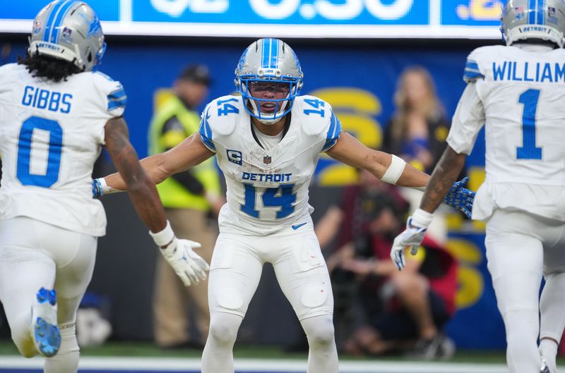 Dec 14, 2025; Inglewood, California, USA; Detroit Lions running back Jahmyr Gibbs (0), Detroit Lions wide receiver Amon-Ra St. Brown (14) and Detroit Lions wide receiver Jameson Williams (1) celebrate after a touchdown during the second quarter against the Los Angeles Rams at SoFi Stadium. Mandatory Credit: Kirby Lee-Imagn Images