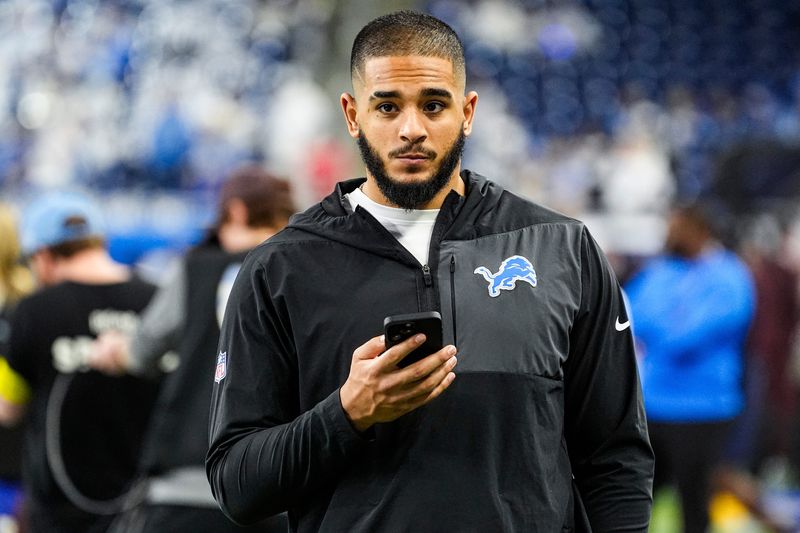 Detroit Lions defensive end Ahmed Hassanein (61) looks on during warmup before the Dallas Cowboys game at Ford Field in Detroit on Thursday, Dec. 4, 2025.