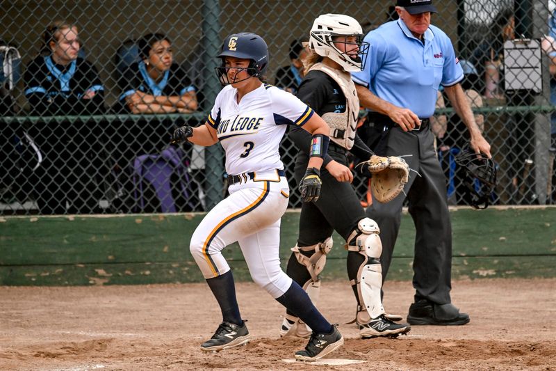 Grand Ledge's Bella Perez scores against Lansing Catholic during the second inning on Friday, May 22, 2026, in the Softball Classic final at Ranney Park in Lansing.
