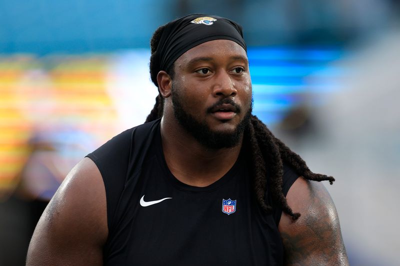 Jacksonville Jaguars defensive tackle Davon Hamilton (52) warms up before an NFL football matchup at EverBank Stadium, Sunday, Jan. 4, 2026, in Jacksonville, Fla. [Corey Perrine/Florida Times-Union]