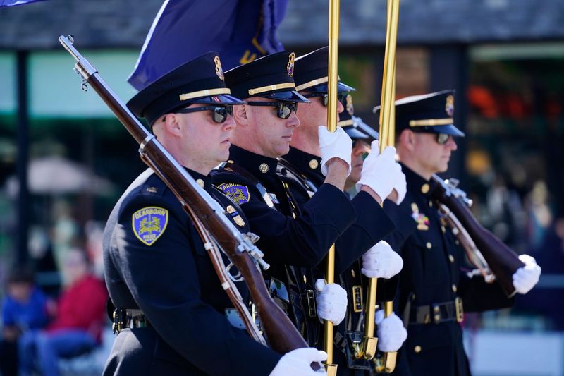 The Dearborn Police Honor Guard march on Michigan Avenue during the 100th annual Dearborn Memorial Day parade on Monday, May 25, 2026.