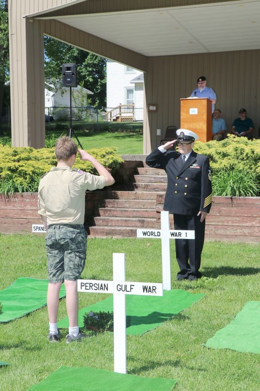 Members of local Boy Scouts lay wreaths at representative graves and recognized by Larry Richardson, FCCS (SW) United States Navy (retired).