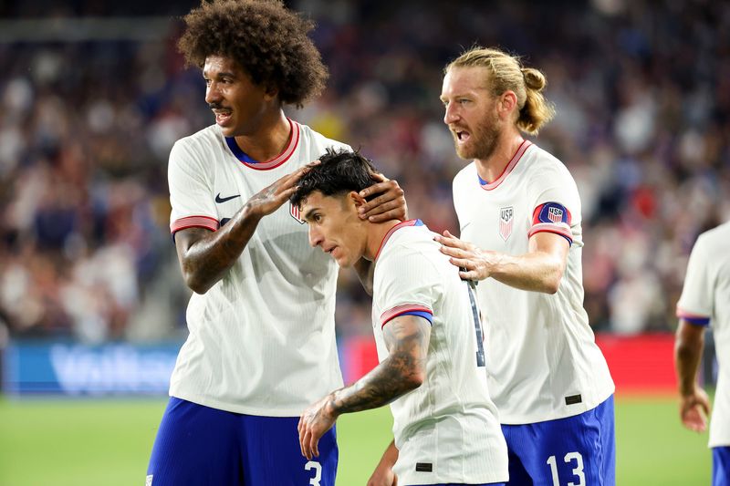 Sep 9, 2025; Columbus, Ohio, USA; US Men's National Team forward Alejandro Zendejas (17) celebrates his goal with defender Chris Richards (3) and defender Tim Ream (13) during the first half against Japan at Lower.com Field. Mandatory Credit: Joseph Maiorana-Imagn Images