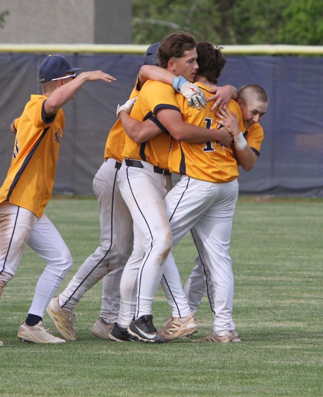 Hartland players mob Michael Bernardi after his single in the bottom of the seventh gave the Eagles a 5-4 victory over Brighton in a pre-district baseball game on Tuesday, May 26, 2026.
