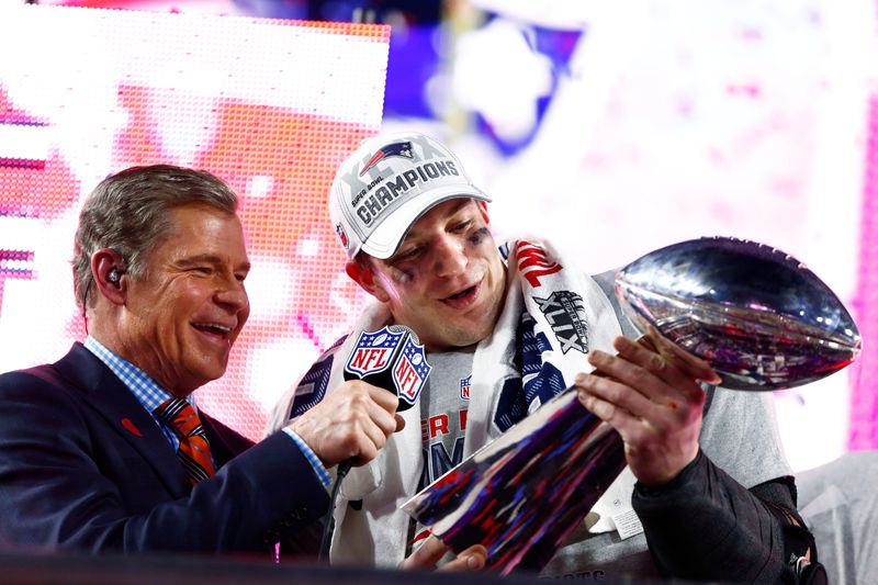 Patriots tight end Rob Gronkowski celebrates with the Vince Lombardi trophy following the victory against the Seahawks in Super Bowl XLIX at University of Phoenix Stadium.