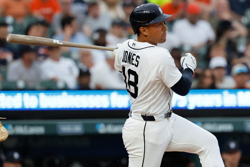May 26, 2026; Detroit, Michigan, USA; Detroit Tigers designated hitter Jahmai Jones (18) hits an RBI single in the fifth inning against the Los Angeles Angels at Comerica Park. Mandatory Credit: Rick Osentoski-Imagn Images