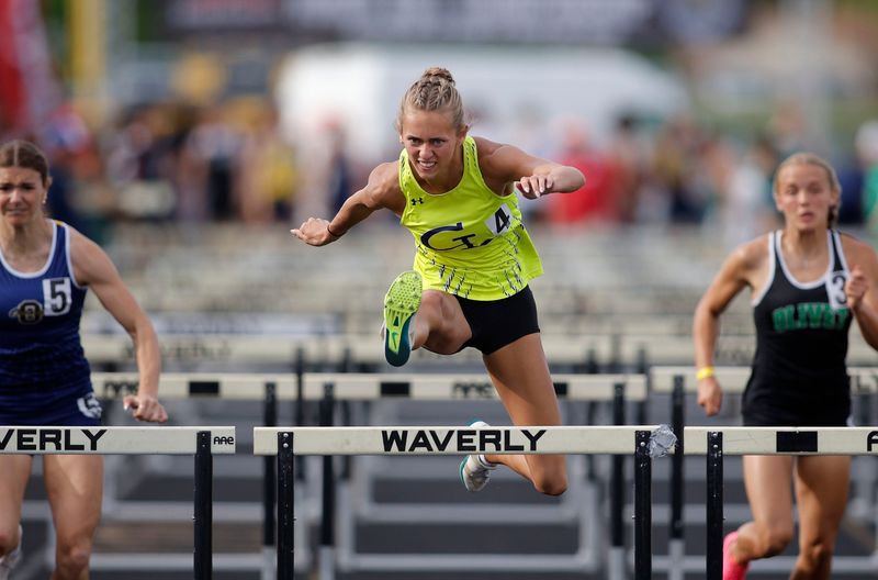 Grand Ledge's Katie Blue clears the final hurdle en route to winning the 100-meter hurdles during the Greater Lansing Honor Roll track meet, Tuesday, May 26, 2026, at Waverly High School.