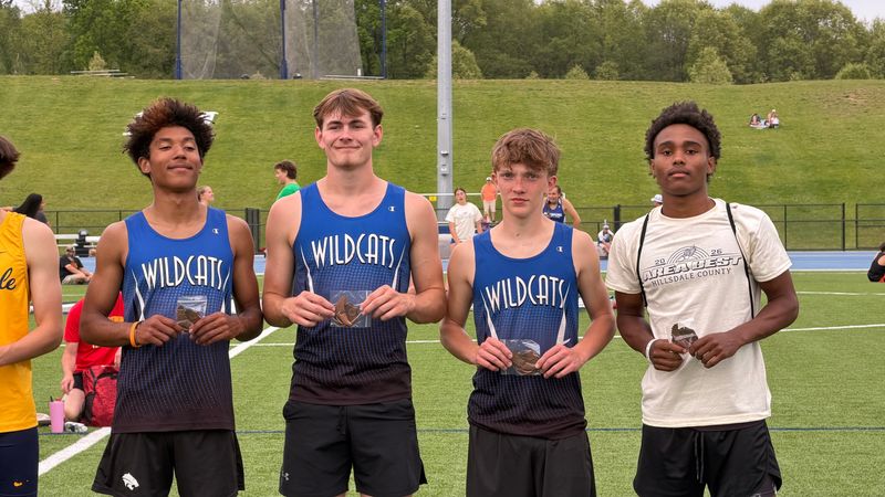 Senior Jacob Drawe (second from left) with his relay teammates (left to right) Brendon Nave, Gavin Leggett and Mondale Knepfler after taking first at the Area Best meet.