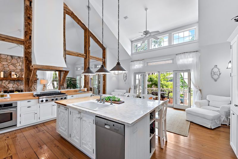 This 5,538-square-foot New Buffalo residence features six bedrooms, five bathrooms and sits on nearly an acre of land. It lists for $3.85 million and includes a private boat dock and deeded rights to Wolverine Beach.