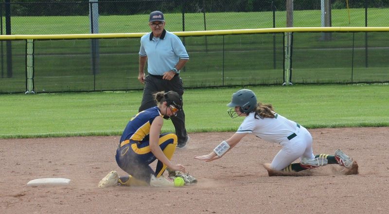 Emma Sparks steals second base for Flat Rock as Whiteford shortstop Bailey Spradling takes the throw during a 3-2 Flat Rock victory on Wednesday, May 27, 2026.