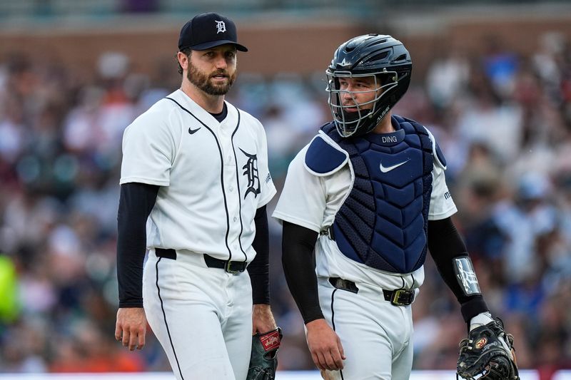 Detroit Tigers pitcher Casey Mize (12) talks to catcher Dillon Dingler (13) as they walk off the field after top of fourth inning against Los Angeles Angels at Comerica Park in Detroit on Wednesday, May 27, 2026.
