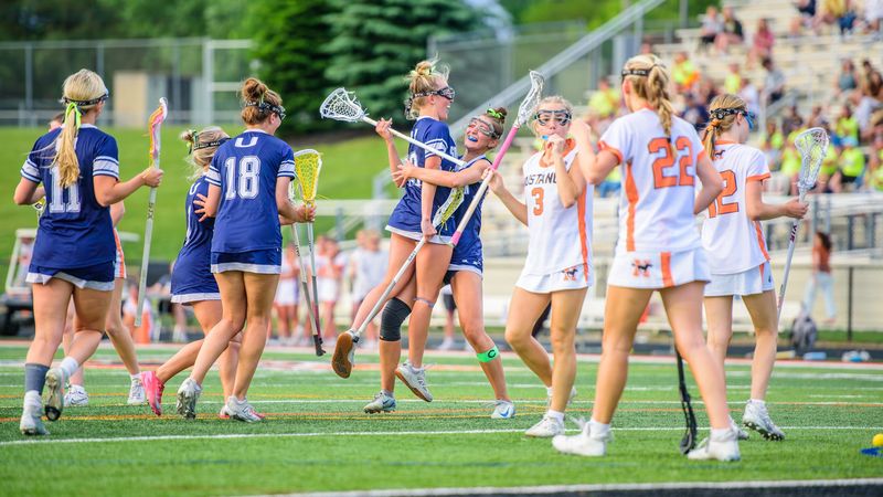 South Lyon Unified celebrates a goal during the Division 1 girls lacrosse regional semifinal on Wednesday, May 27, 2026, at Sports Den Field in Northville.