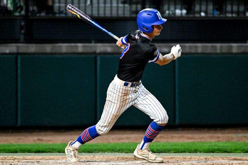 Mason's Ryan Myers hits a two-run double against Grand Ledge in the sixth inning on Wednesday, May 27, 2026, during the Diamond Classic semifinal at McLane Stadium in East Lansing.