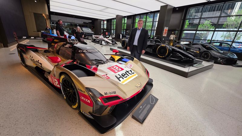GM Motorsports chief Jim Campbell at GM Entrance One HQ at Hudson's Detroit with a trio of fire-breathers, from right: Corvette Z06 GT3.R, Cadillac F1, Cadillac V-Series.R