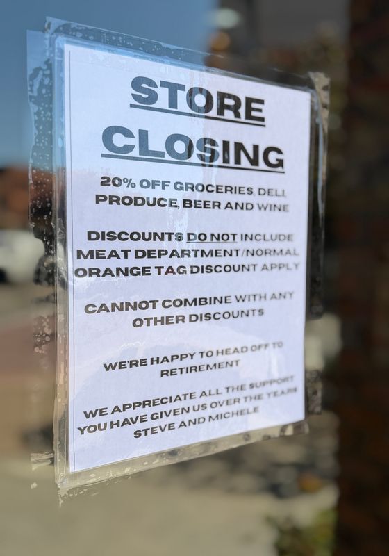 A sign announcing the closure of Country Style Market is posted on the store’s front door on May 28, 2026 in downtown Port Huron. The sign states the business is preparing for retirement and closing May 30.